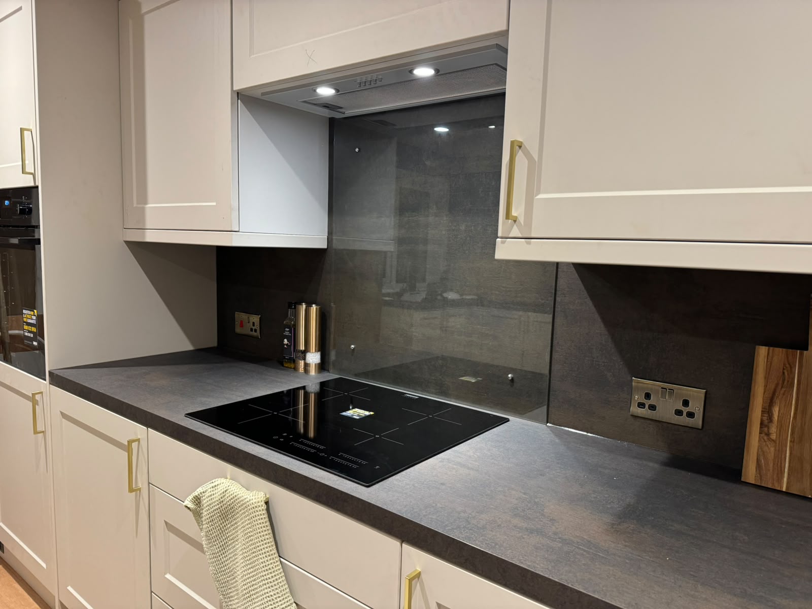 Kitchen and bathroom electrical installation by Electrust — sockets, downlights and extractors