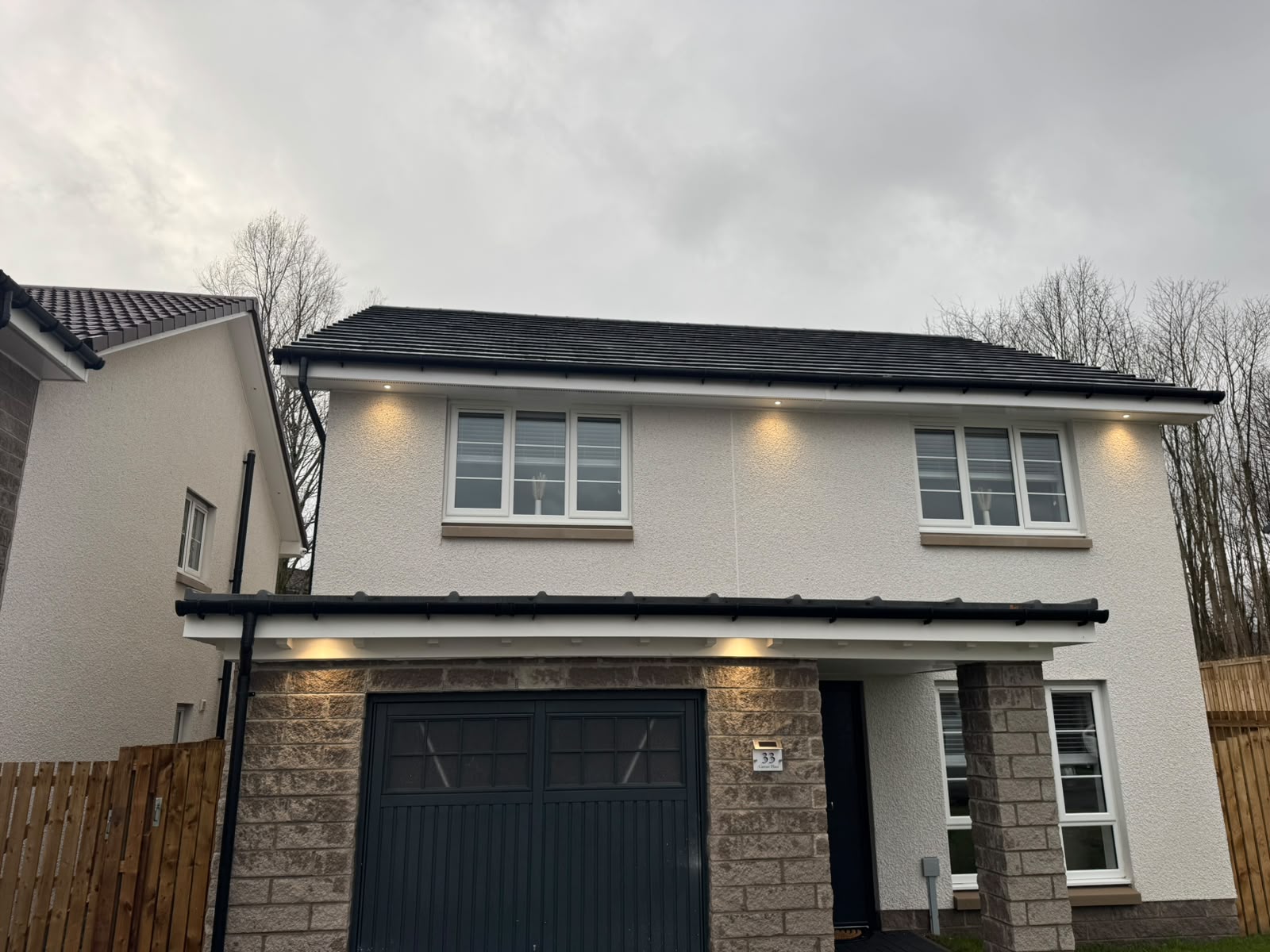 Soffit lighting installation by Electrust — LED downlights under the eaves of a Scottish home
