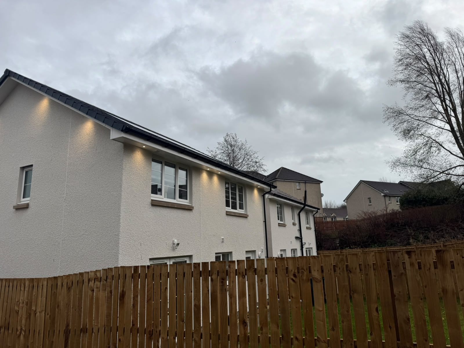 Soffit lighting installation by Electrust — LED downlights under the eaves of a Scottish home