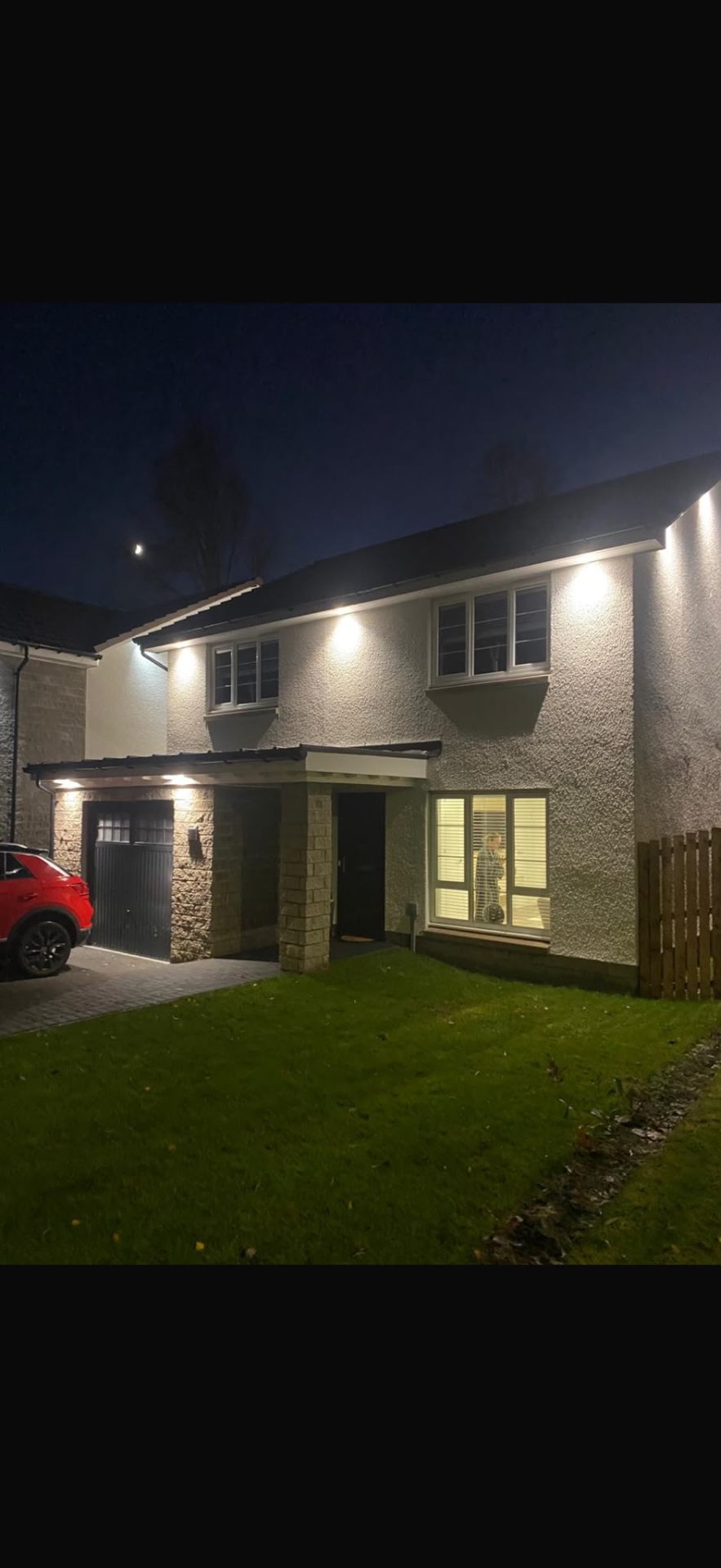 Soffit lighting installation by Electrust — LED downlights under the eaves of a Scottish home